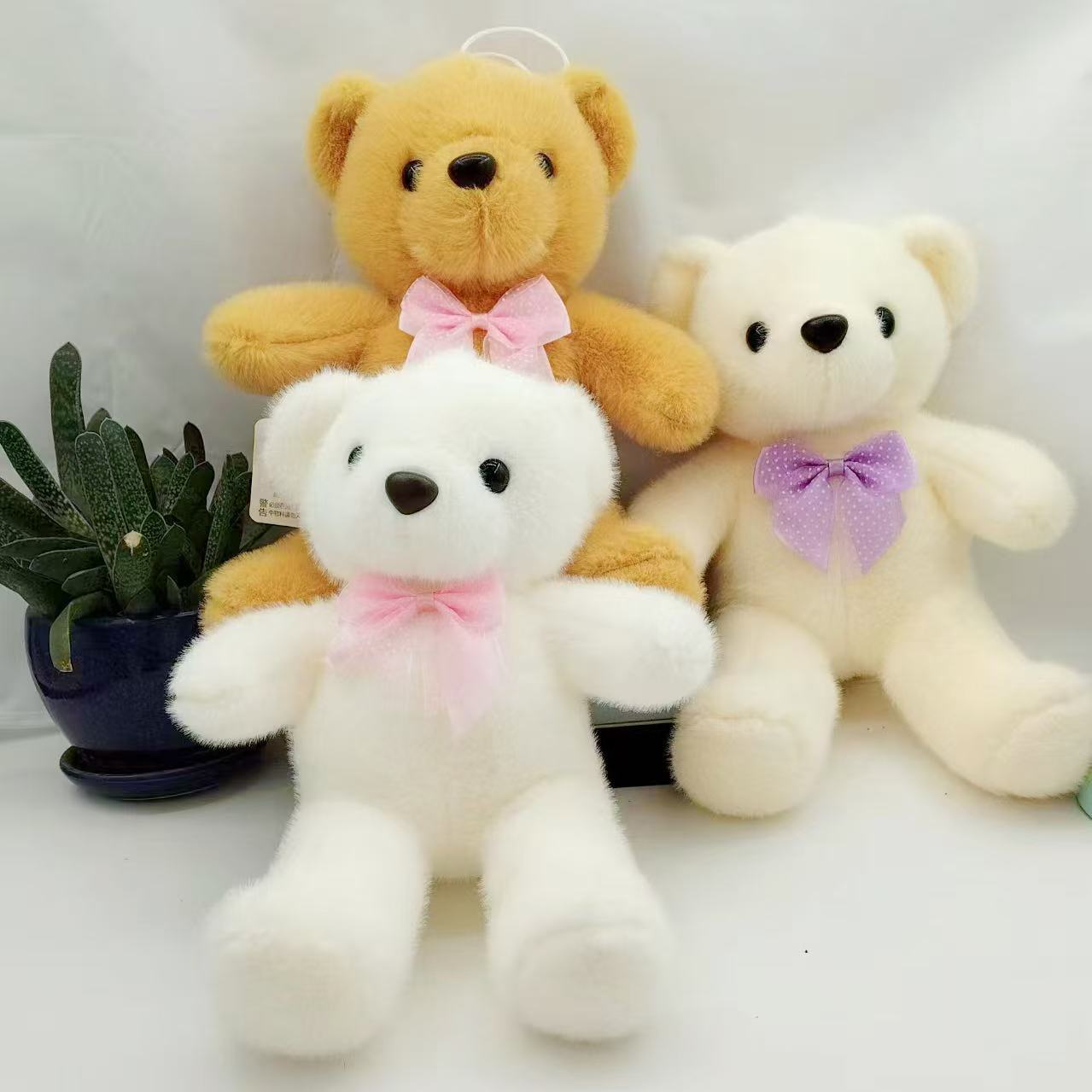 Nuevo flujo de ocho pulgadas juguetes de peluche agarrar muñecas de boda tirar muñecas empujar regalos al por mayor