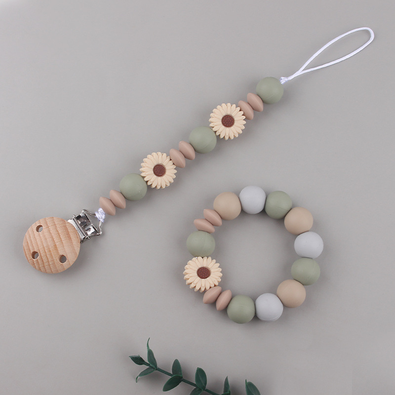 Nueva margarita pequeña cadena de tetina para calmar a los bebés anti-caída cadena creativa DIY pulsera de goma de diente dos conjuntos