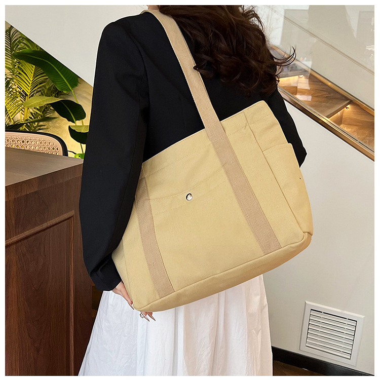 Wholesale of new women's single-shoulder bags, cross-border simple and casual canvas bags, Korean version LOGO printed commuter tote bags undefined