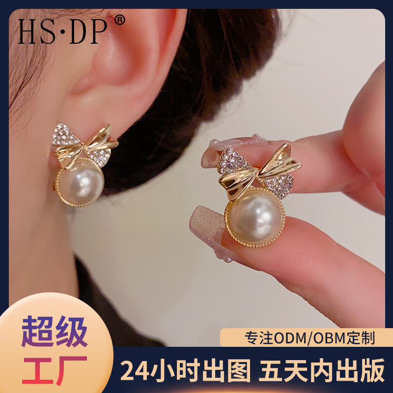 Cute elegant fashionable small design earrings with bow from pearl
