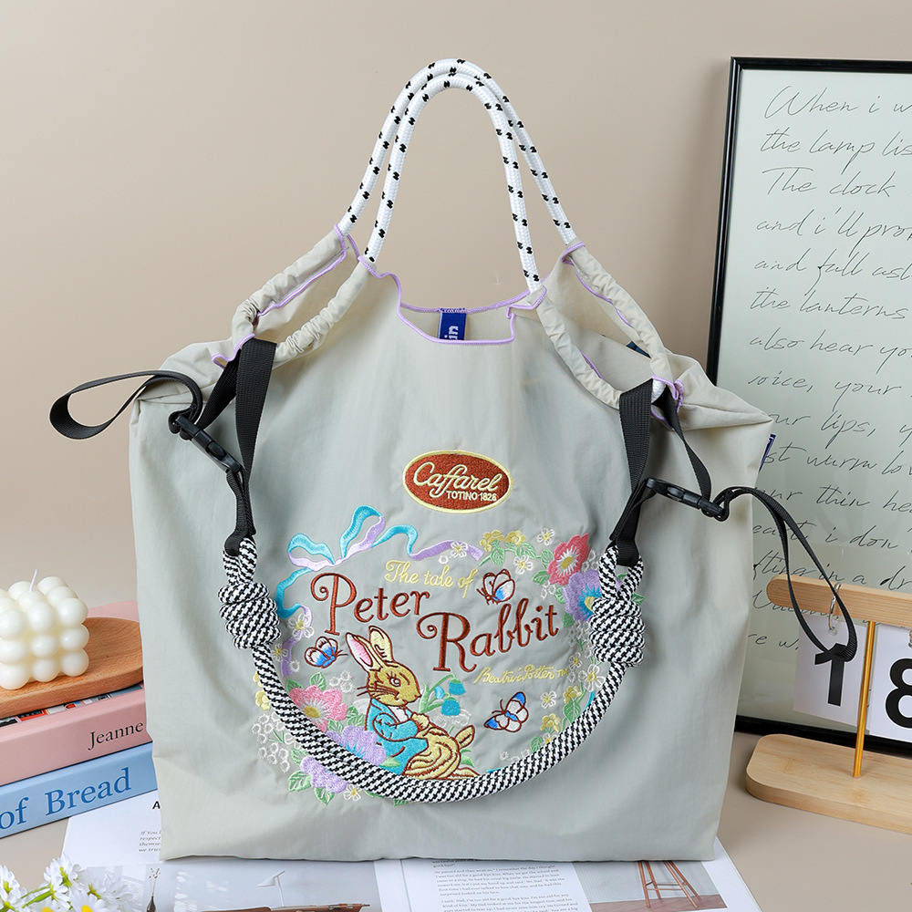 Light gray Mr. Rabbit + black and white shoulder strap