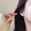 Small sophisticated golden design earrings, 2023 collection