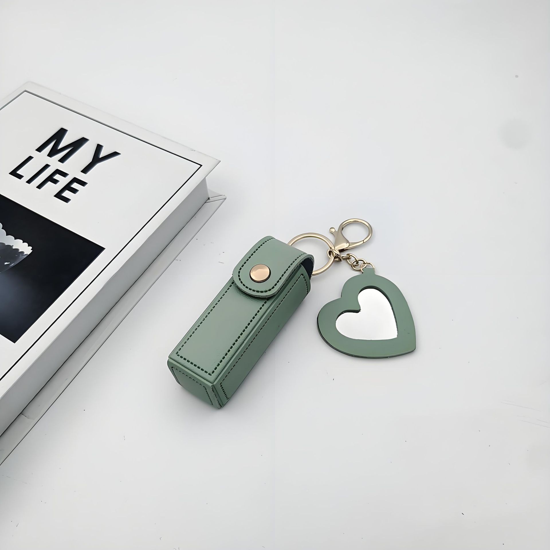 Bolso de cambio transfronterizo sobre rojo espejo creativo llavero colgante pequeño PU cuero bolso de coche accesorios accesorios en stock