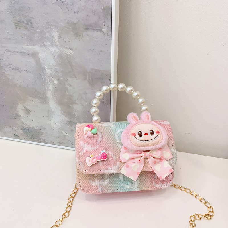 Bagos para niños 2025 nuevo estilo coreano de niña princesa bolso de cambio de mano lindo bolso de hombro de dibujos animados de peluche