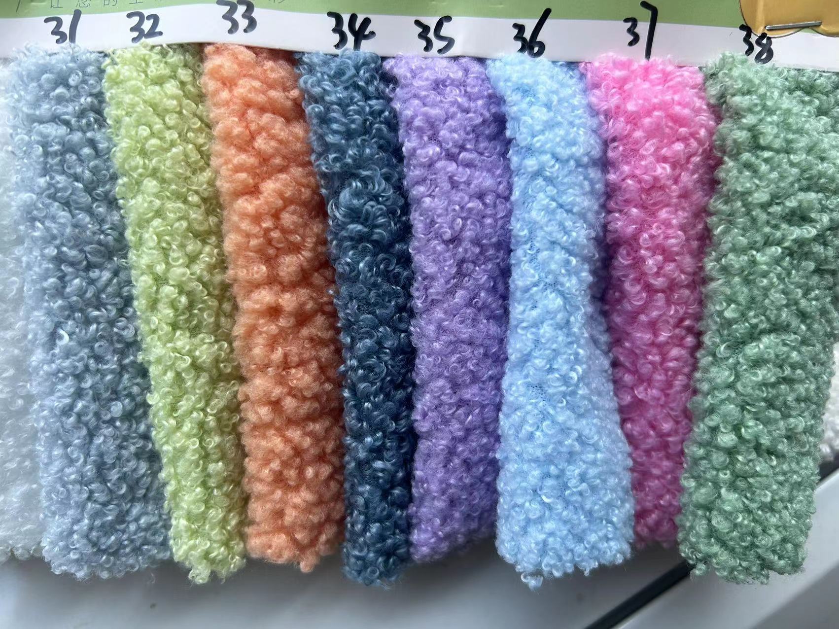Super suave tela de terciopelo de peluche llanura pequeña partícula poliéster felpa abrigo ropa de tela de juguete para niños en stock