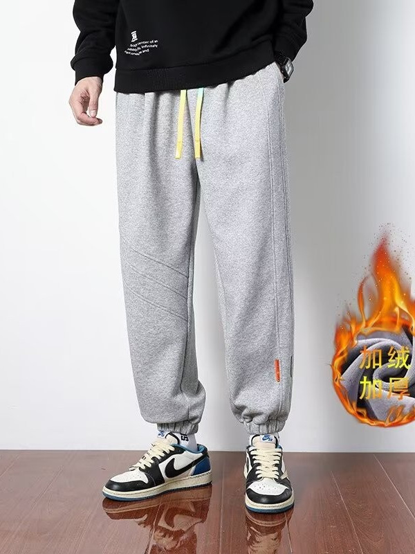 Primavera y otoño 2024 nuevos pantalones casuales para hombres, pantalones deportivos sueltos de la marca de moda juvenil, pantalones deportivos sueltos de color sólido