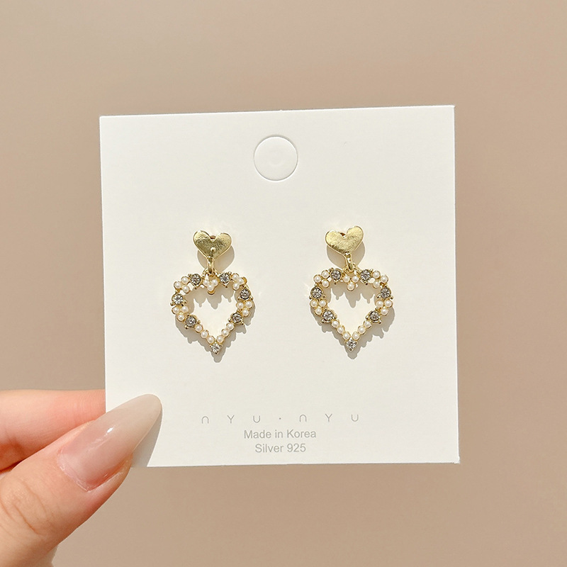 Pendientes de aro lisos para mujer, lujo ligero, pendientes de alta gama, pendientes populares, aretes de diseño exclusivo, aretes de otoño e invierno al por mayor