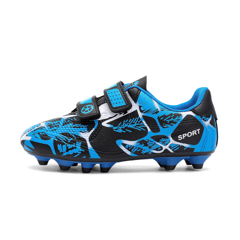 Niños y niñas transfronterizos transpirables cómodos deportes ociosos bajos clavos de clavos de hierba competición zapatos de fútbol de fábrica para niños