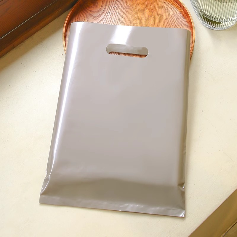 Bolsa de mano de tienda de ropa de grosor, bolsa de embalaje de ropa para niños y niñas, bolsa de almacenamiento de cosméticos, bolsa de regalo, bolsa de embalaje comercial