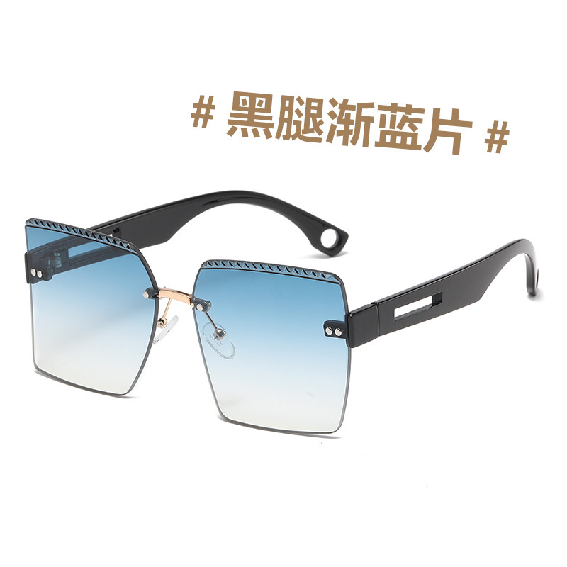 Gafas de sol a prueba de sol curvadas europeas y americanas gafas de sol a prueba de UV de corte liso de moda de las mujeres