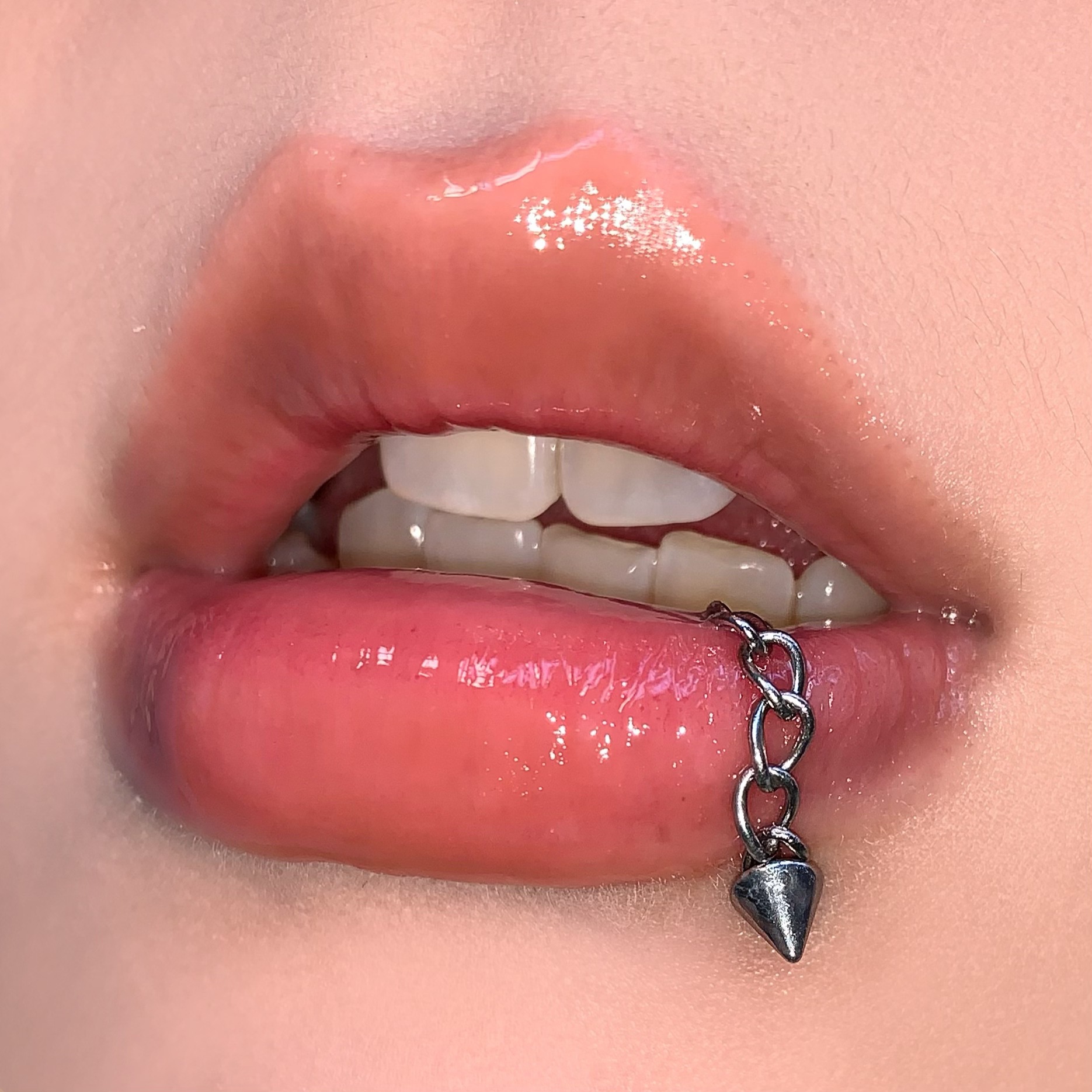 Silver pointed spike labret stud material detail