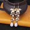 Cute earrings with tassels from pearl, flowered