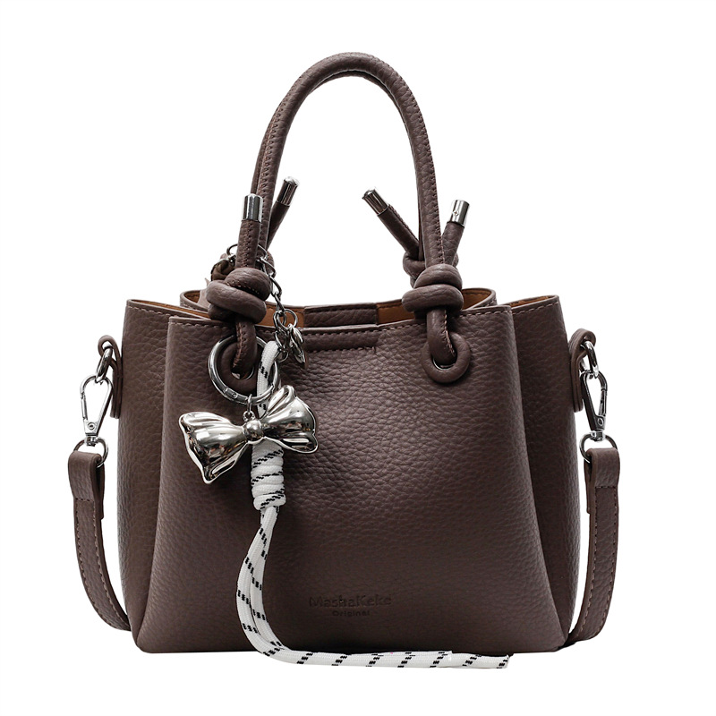 Bolso de mano de estilo explosivo de comercio exterior para mujer 2025 nuevo bolso de hombro casual simple bolso de cubo de sentido avanzado de moda salvaje