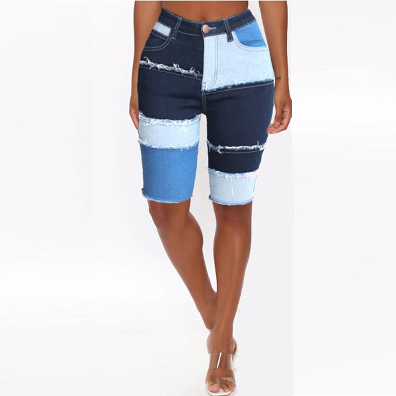 Comercio exterior nueva personalidad transfronteriza moda de cinco puntos Denim pantalones de mujer nuevos pantalones de patchwork de levantamiento de cadera elástica alta 2023 verano de mujer