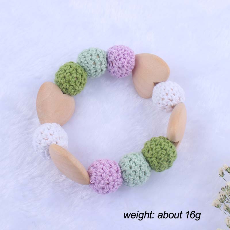 Nueva historieta del bebé haya amor mordedor juguete DIY macaron gran bola de lana mordedura pulsera