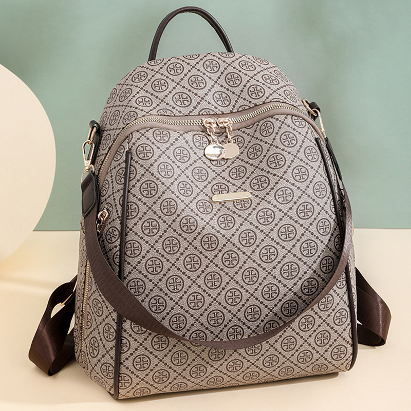 2024 nueva mochila de cuero suave casual para mujer, impresión de moda, color de contraste, mochila de viaje multifuncional de doble uso al por mayor