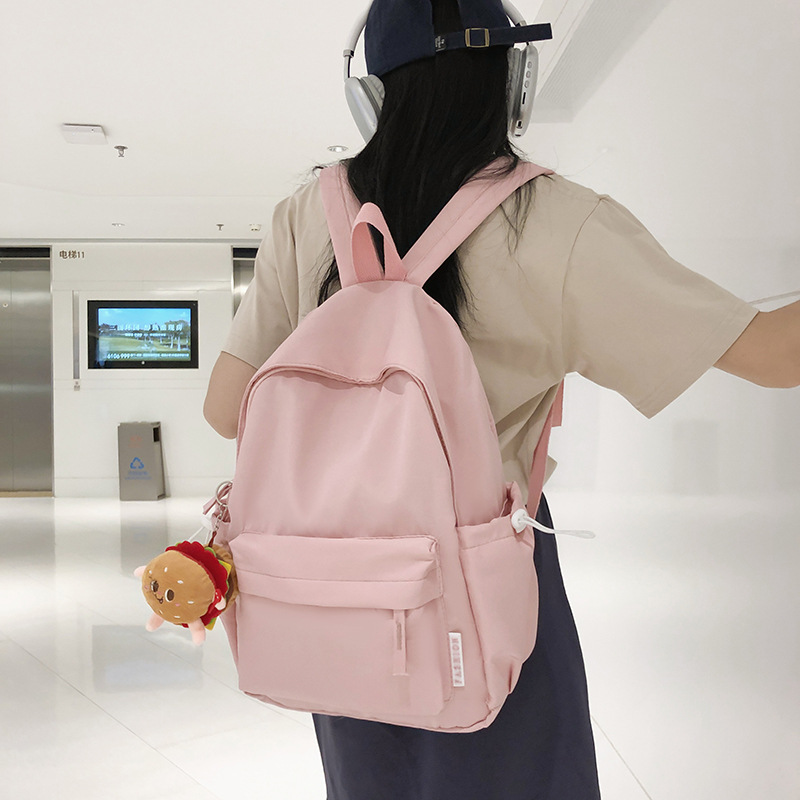 Mochila al por mayor verano nuevo caramelo color japonés simple mochila de las mujeres Junior High School moda gran capacidad mochila