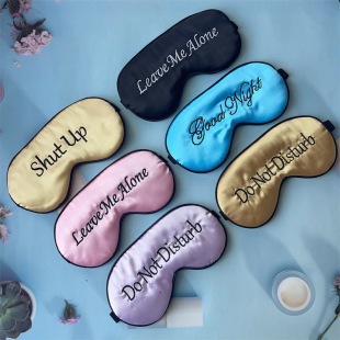 Imitation silk embroidery eye mask shading sleep eye mask English pattern embroidery logo shading eyelash eye mask now