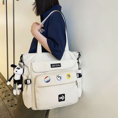 新型シンプルファッションショルダーバッグ女性大容量通勤男女通用ブリーフケース学生授業カバン