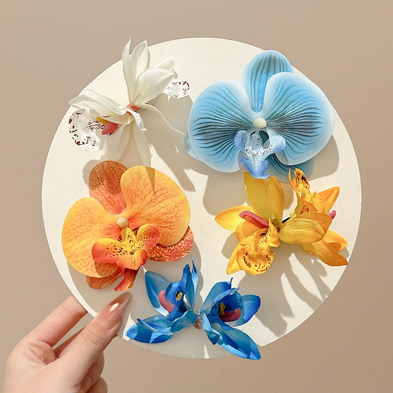 Atmosfera orquídea mariposa flores clip para el cabello mujeres primavera / verano 2025 nuevo clip lateral tocado tarjeta de cabello vacaciones de mar