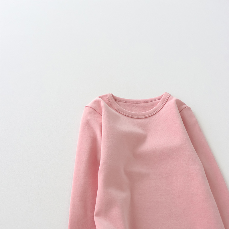 Camiseta de manga larga de algodón puro para niños 2026, camiseta básica para primavera y otoño, top cepillado de cuello redondo de color liso y corte holgado para niños y niñas.