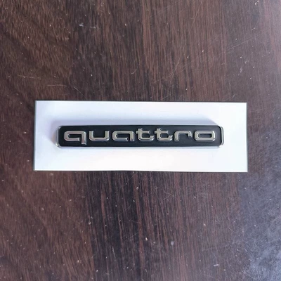 Car logo four-wheel drive 40 45TFSI displacement - standard-four-wheel-drive-emblem-black-background-with-silver-lettering