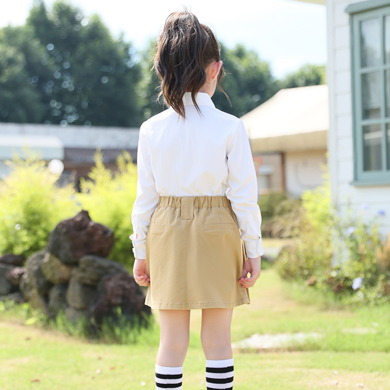 Falda de estilo universitario para niñas Falda de uniforme escolar caqui para niños Nuevos productos de otoño Falda plisada para estudiantes de escuela primaria de jardín de infantes