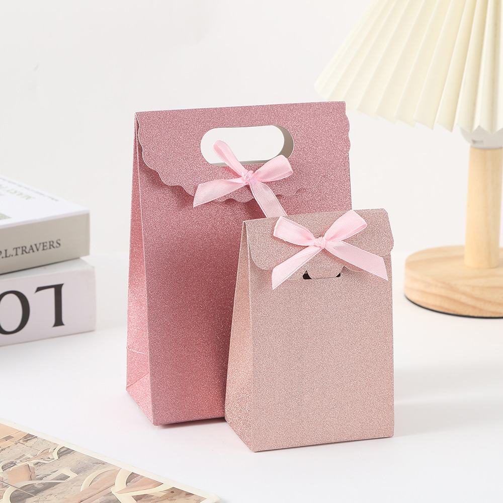 Bolsa de papel de cartón blanco con solapa de cebolla brillante Bolsa de embalaje de regalo de color caramelo Bolsa de embalaje de postre con lazo de sentido avanzado Bolsa de caramelo