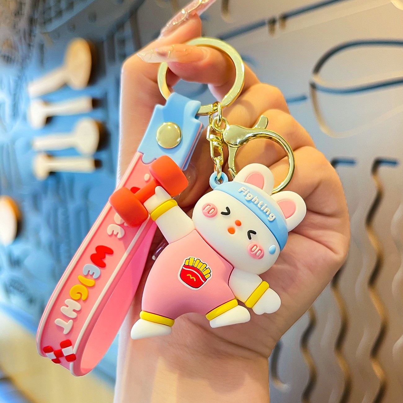 Muñeca de goma goteando bolsas escolares colgantes colgantes de muñecas colgantes de la máquina del mercado nocturno regalos al por mayor llaveros de dibujos animados