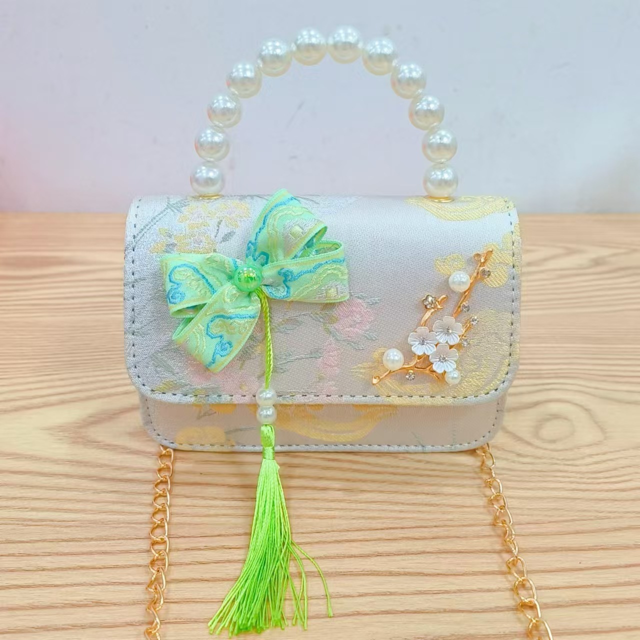 Bolsas de niños arco de estilo chino borda de niña pequeña princesa perla bolsa de cambio de mano al por mayor