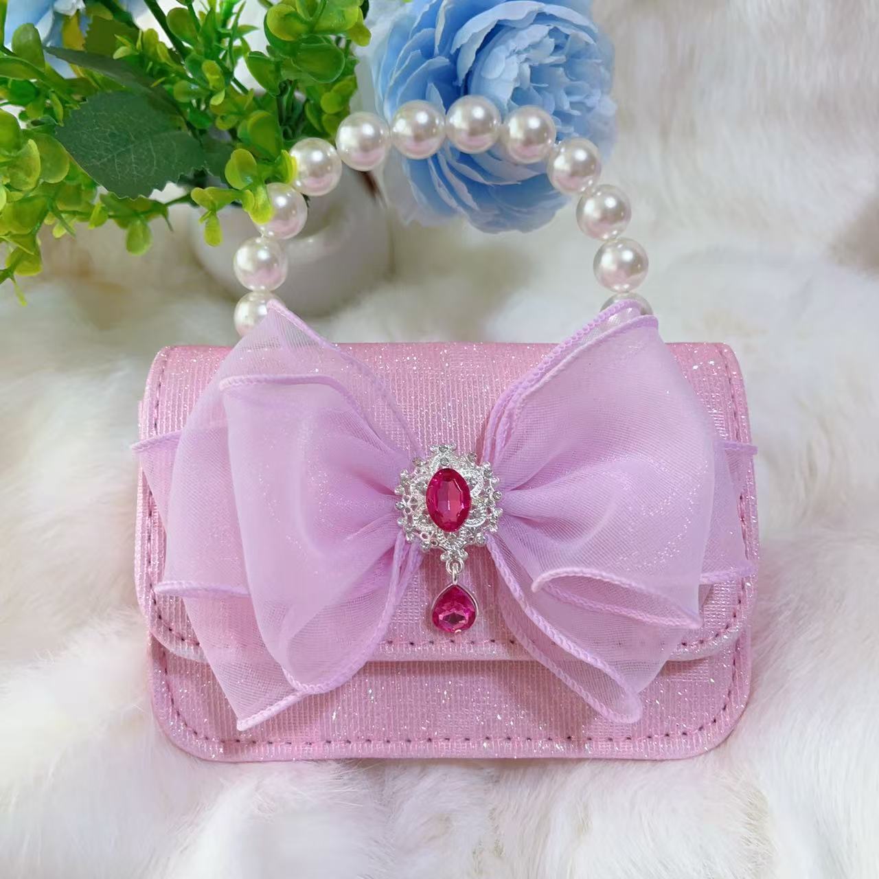 Bagos de perlas para niños 2025 nuevos bolsos de niños bolsos de mochila de niñas bolsos accesorios de princesa bolsos de viento de fragancia