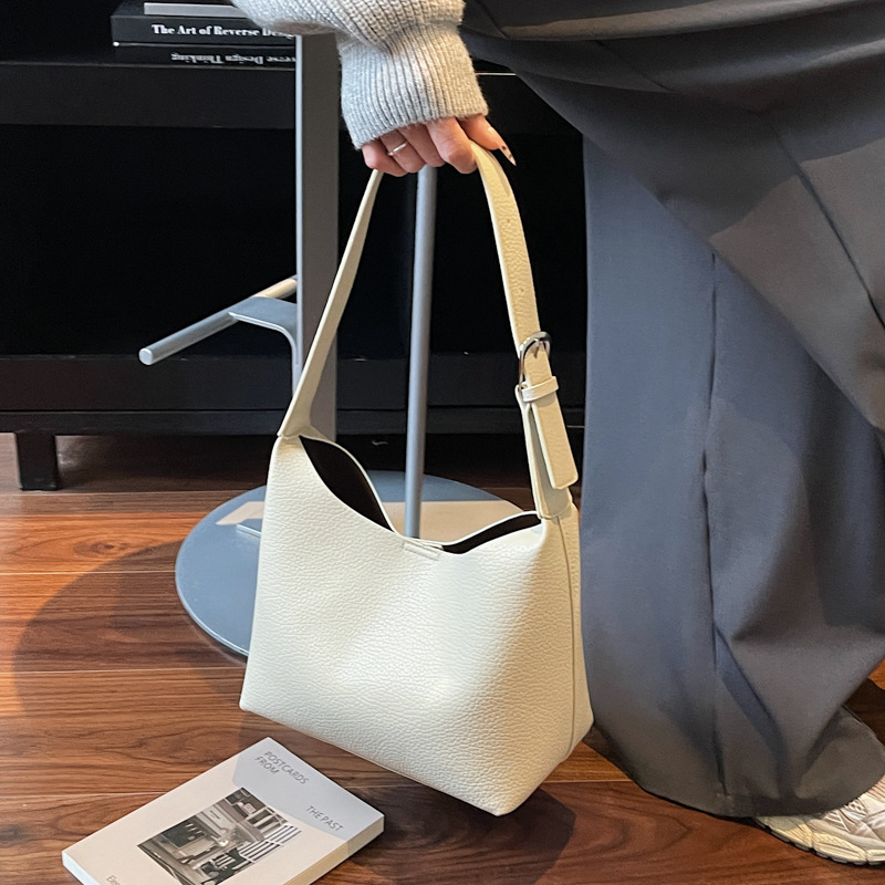 Bolsos de cubo retro de alta calidad para mujeres otoño / invierno 2025 nuevo nicho Zhong commuting mochila de hombro bolso de trabajo diario
