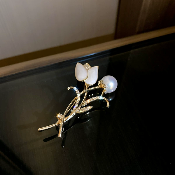 Beads from pearl, brooch