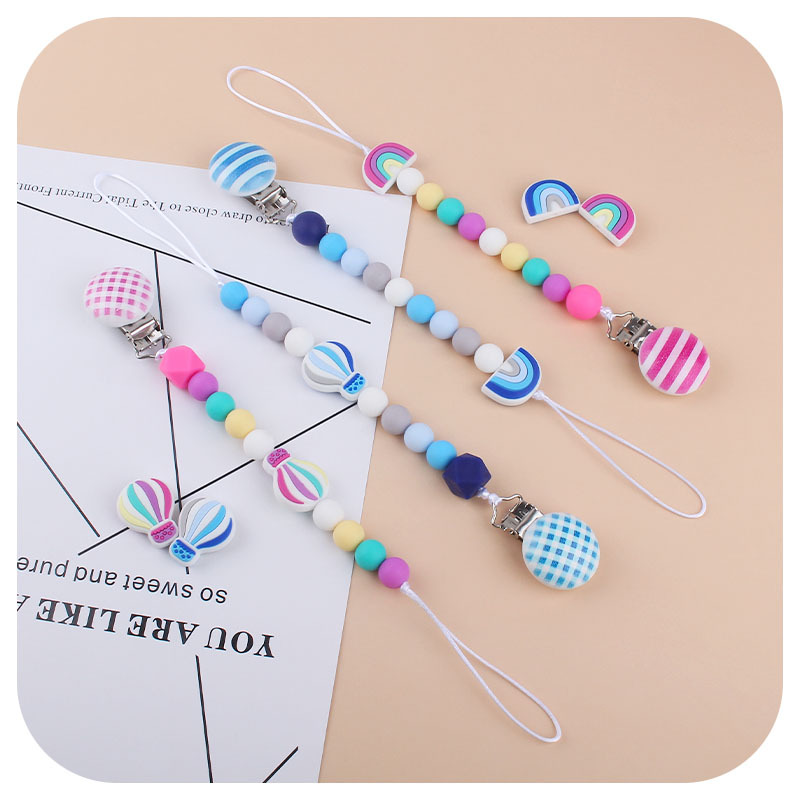 Nuevo bebé dibujos animados globo de aire caliente pulsera de silicona teether palo pezón cadena anti-gota cadena juguete teether