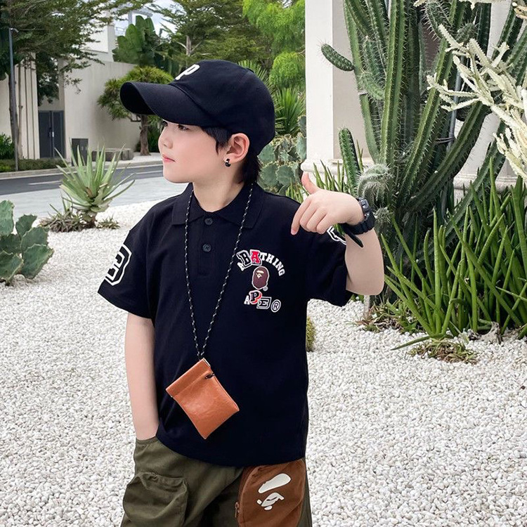 2023 Summer New Boys' Trendy Brand Letter Polo Shirt Small and Medium-sized Children's Black and White Short-sleeved T-shirt Lapel Top Trendy