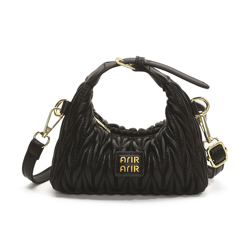 Bolsa de hombro de chicas plegadas de moda simple color sólido mini bolso de bebé 2025 nuevo bolso infantil transfronterizo
