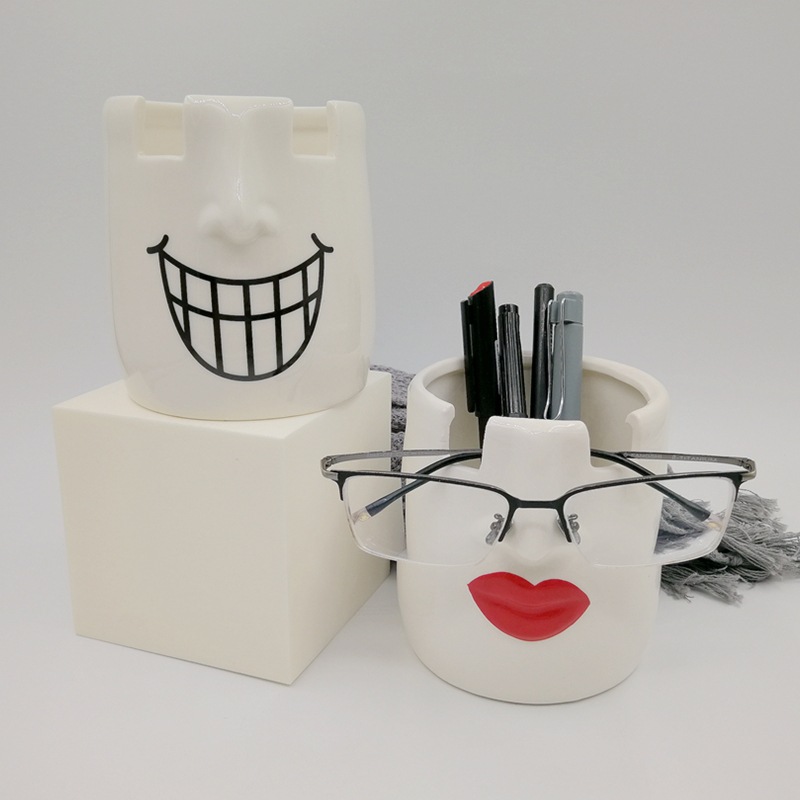 Portalápices de cerámica europea y americana transfronteriza Portalápices de cerámica de colores Portalápices de escultura facial Portalápices de gafas Portalápices de almacenamiento Labios rojos Portalápices de escritorio