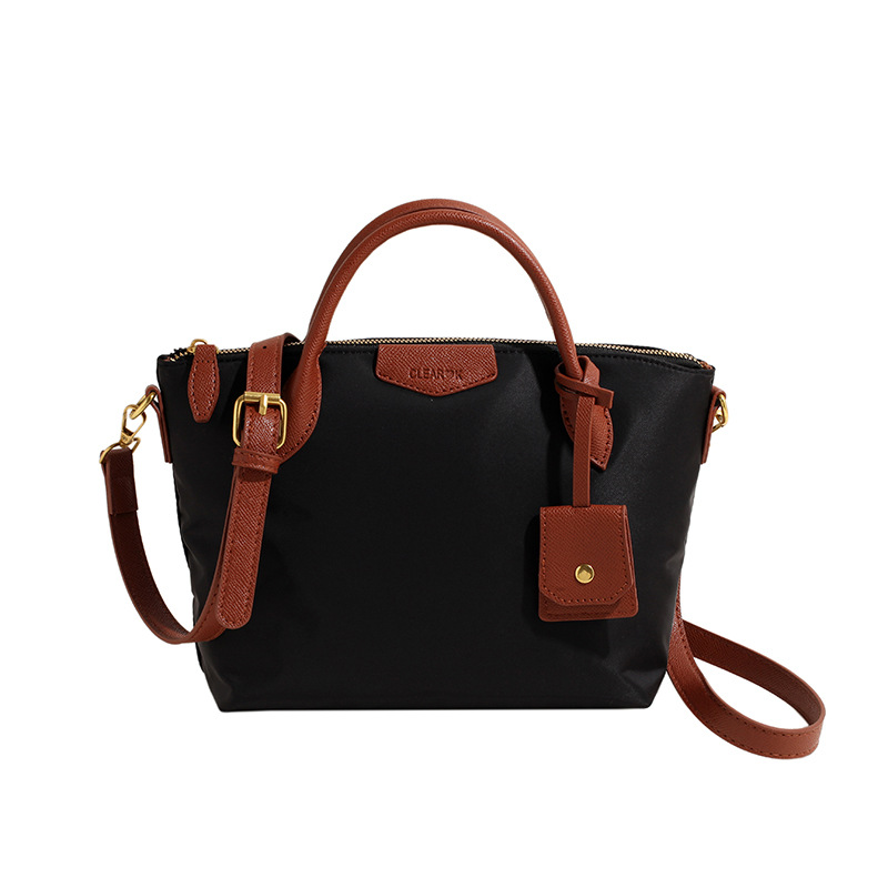 Transfronterizo nueva tela de nylon ligero Portátil Bolsa de mano de las mujeres 2024 primavera popular moda hombro bolsa de mensajero