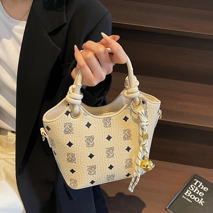 Tendencia impresa bolso de cubo de mano mujer 2025 nueva moda textura versátil bolso de hombro super caliente bolso de mochila