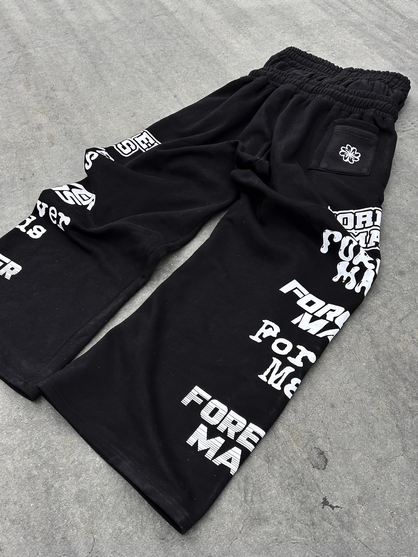 Otoño y invierno nuevos pantalones europeos y estadounidenses de diseño de doble extremo estampado personalidad callejera de piernas largas pantalones casuales para hombres y mujeres image 4