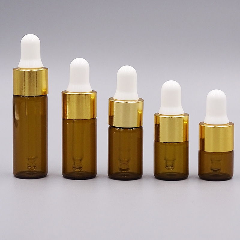 1ml una pieza 3528; botella de color marrón con anillo de oro; vidrio