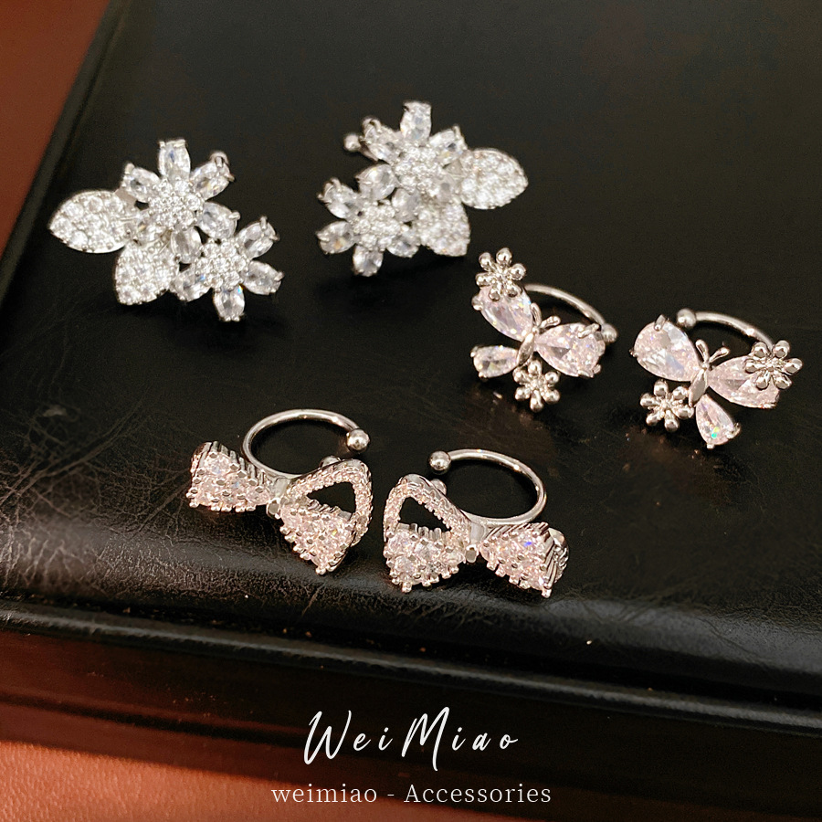 Zircon arco flores orejas clips de orejas mujeres sin agujeros de orejas personalidad temperamento nicho pendientes ligero lujo alta sensación auriculares al por mayor