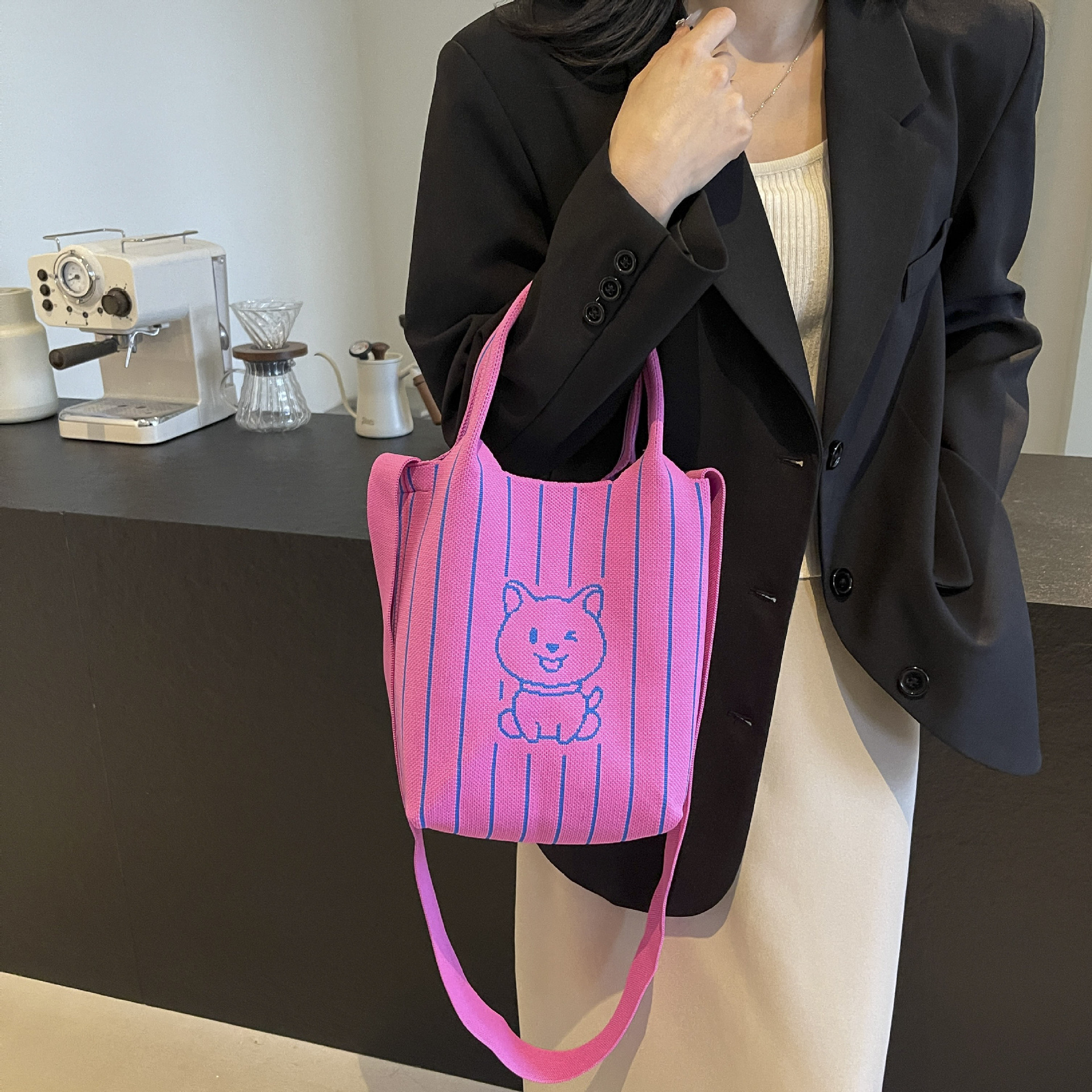 This handbag is a stylish knitted striped shopping bag. It's a popular lady's bear large-capacity tote single-shoulder bag for going out Item Picture