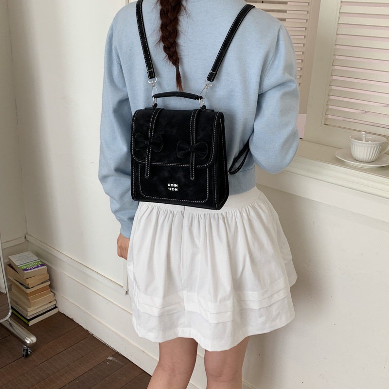Mochila de temperamento de viaje femenino 2026 de alto valor de cara simple coreana mochila de viaje nuevo arco bolso pequeño