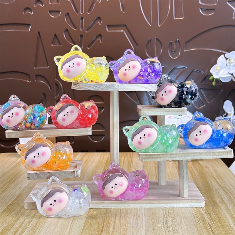 Nocturno explosivo gato macarón super lindo dibujos animados arena flotante en aceite caja ciega pequeña bolsa ciega adornos al por mayor