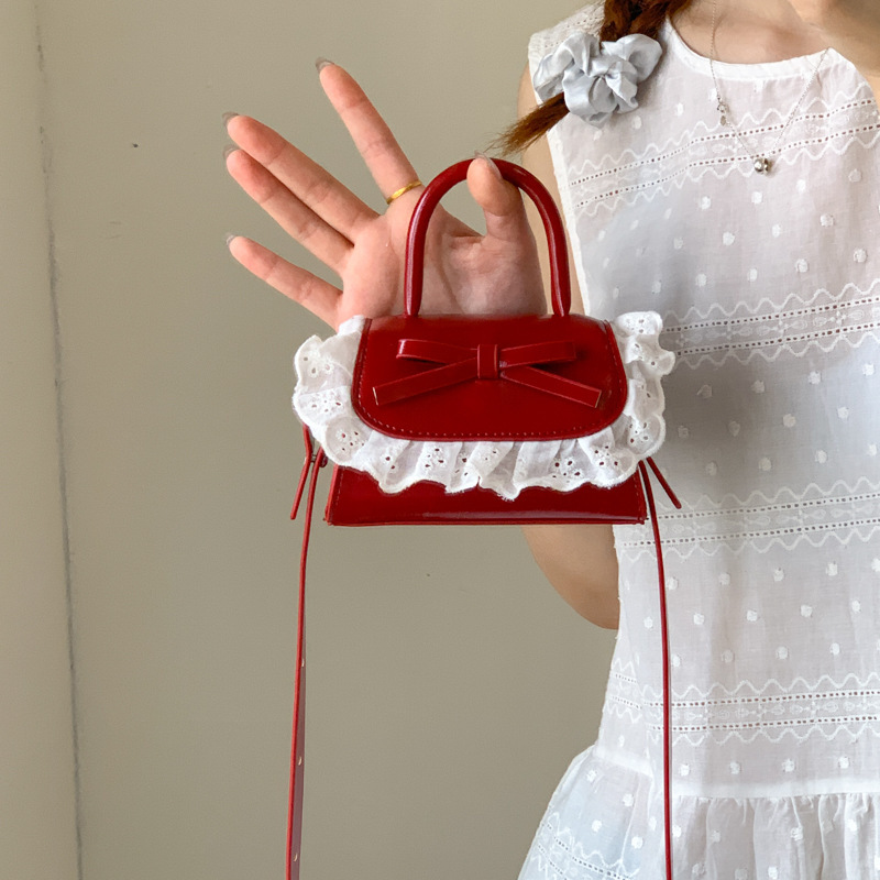Mini bolso para mujeres nuevo lindo arco PU inclinado a través de bolsos pequeños bolsos de lápiz labial para niñas accesorios bolsos de moda para niños