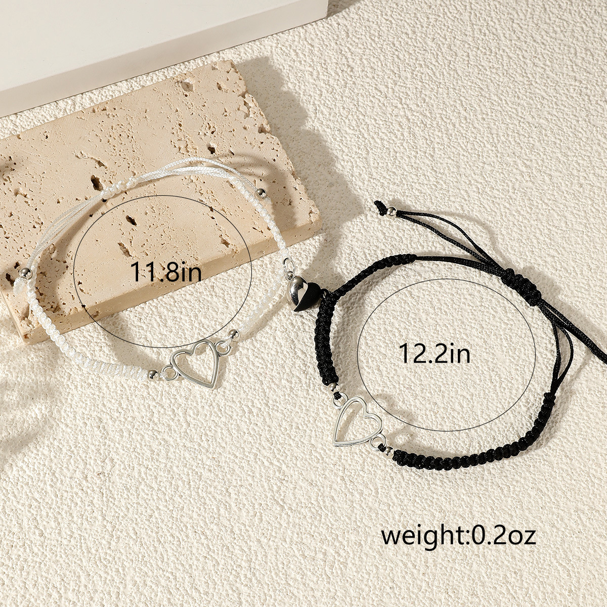 Nuevo par transfronterizo de pulsera tejida de amor hueco blanco y negro pulsera magnética de pareja de larga distancia simple
