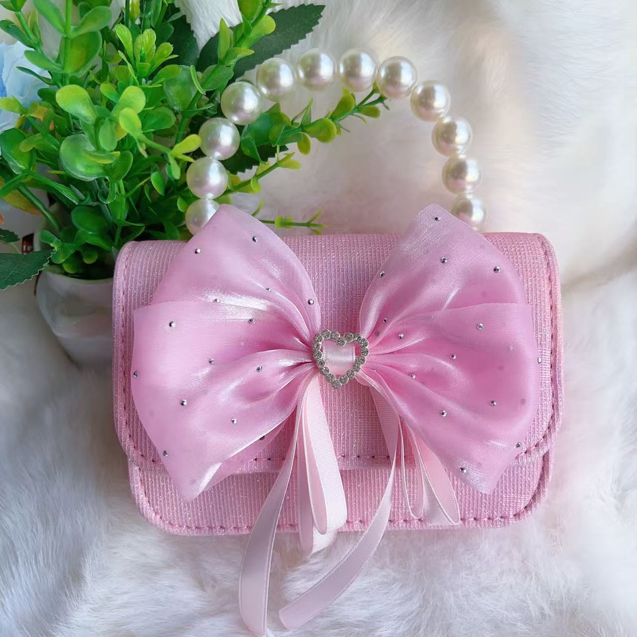 Bagos de perlas para niños 2025 nuevos bolsos de niños bolsos de mochila de niñas bolsos accesorios de princesa bolsos de viento de fragancia