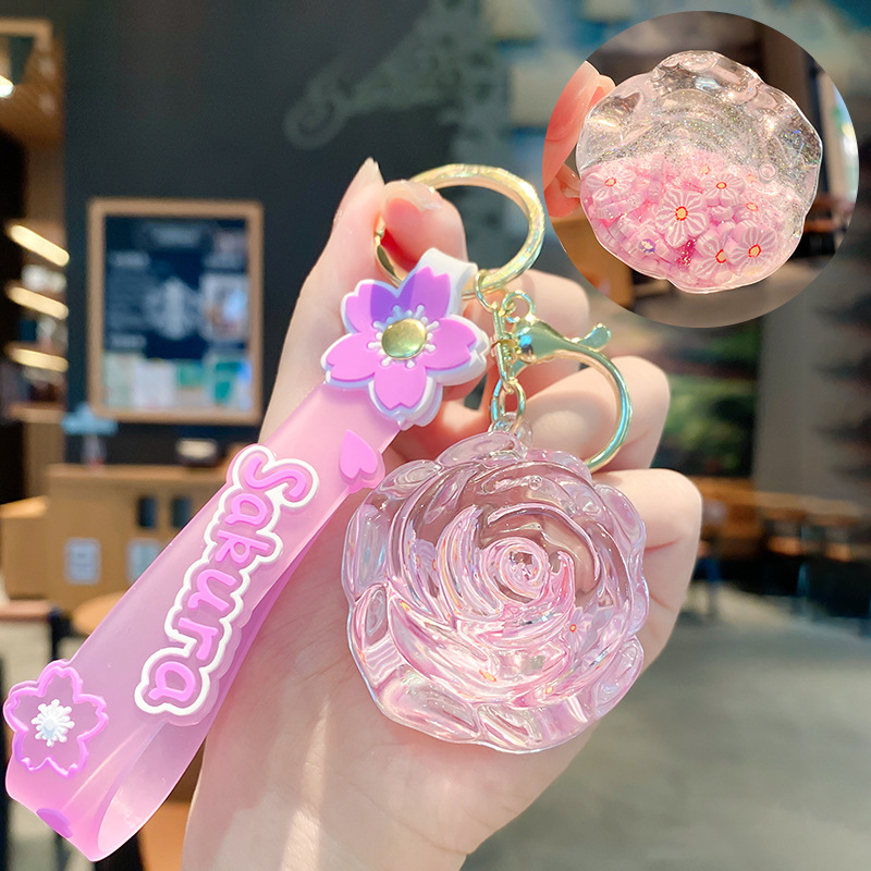 Llavero de rosa de aceite creativo lindo líquido arenas movedizas colgantes pequeños bolsos accesorios pareja pequeños regalos al por mayor