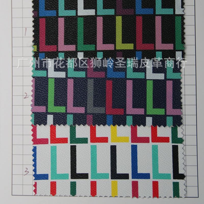 供应印花人造革 PVC格仔纹箱包手袋皮革面料 字母图案SR-1631